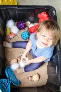 If you're looking for a cheaper, easier way for your child to get in some sensory play, this DIY is for you! Cheap, easy, and fun, my version of a sandbox has fast clean-up, easy maintenance, and convenient moveable location. What more could you ask for?